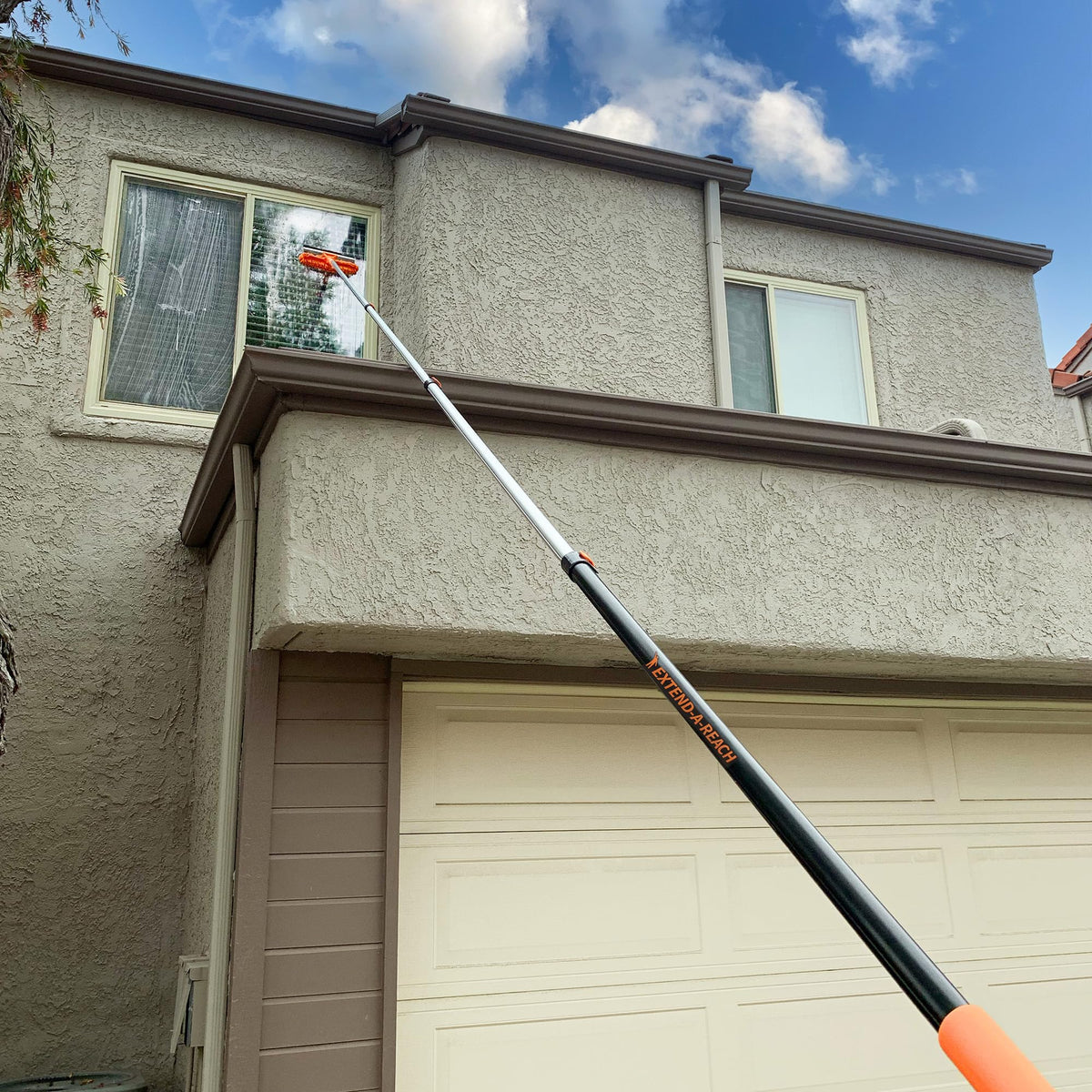EXTEND-A-REACH with paint roller and cobweb duster attachments.