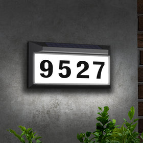 Eyrosa Solar Address Sign day view shows high contrast numbers on white board