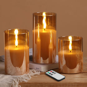 Eywamage gold glass candle with amber glow on a mantel