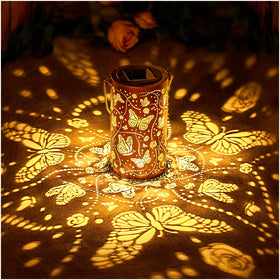 EZTZEN butterfly solar lantern hanging casts warm garden patterns for dusk ambiance