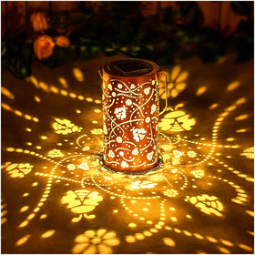 EZTZEN Ladybug solar lantern lights outdoor spaces with decorative patterns.