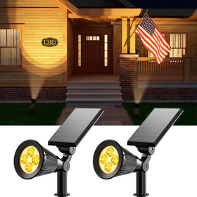 FALOVE solar spotlight 2-pack lights up the patio with warm white glow.