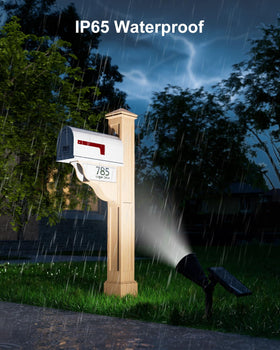 Falove solar spotlight accents a driveway with bright, solar-powered glow.
