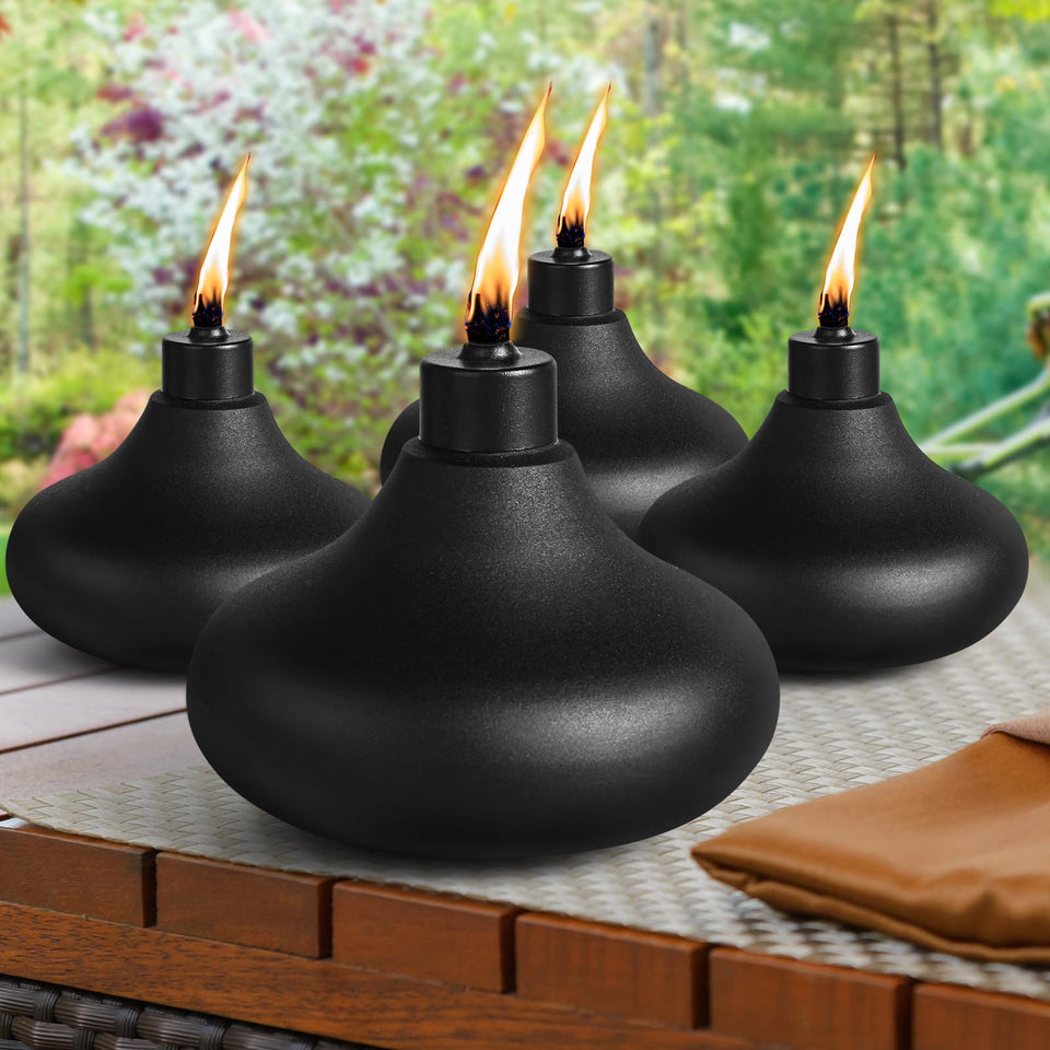 Fan-Torches tabletop torch emits amber glow for cozy outdoor evenings.