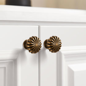 FAPUAL knob on cabinet with soft patina and floral motif