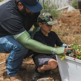 FARMER'S DEFENSE cooling fabric sleeves keeping you comfortable while watering plants