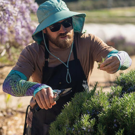 FARMER'S DEFENSE cooling, breathable arm sleeves for gardening comfort.