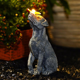 Fashionoda garden statue dog figurine with butterfly enhances outdoor ambience.
