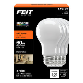 Feit Electric A19 Enhance filament bulb glows softly to create cozy living room ambiance.