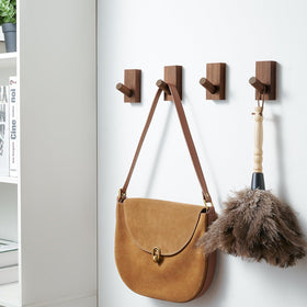 Felidio entryway wall hook organization showing natural wood hooks.
