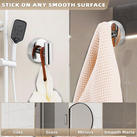 Fenas suction cup hooks on stainless steel surface holding towels in the kitchen.