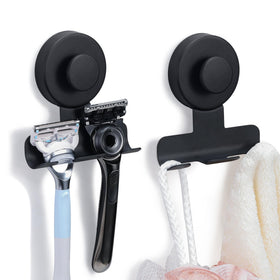 Fenas suction cup razor holder in matte black mounted on tile wall holds razors securely.