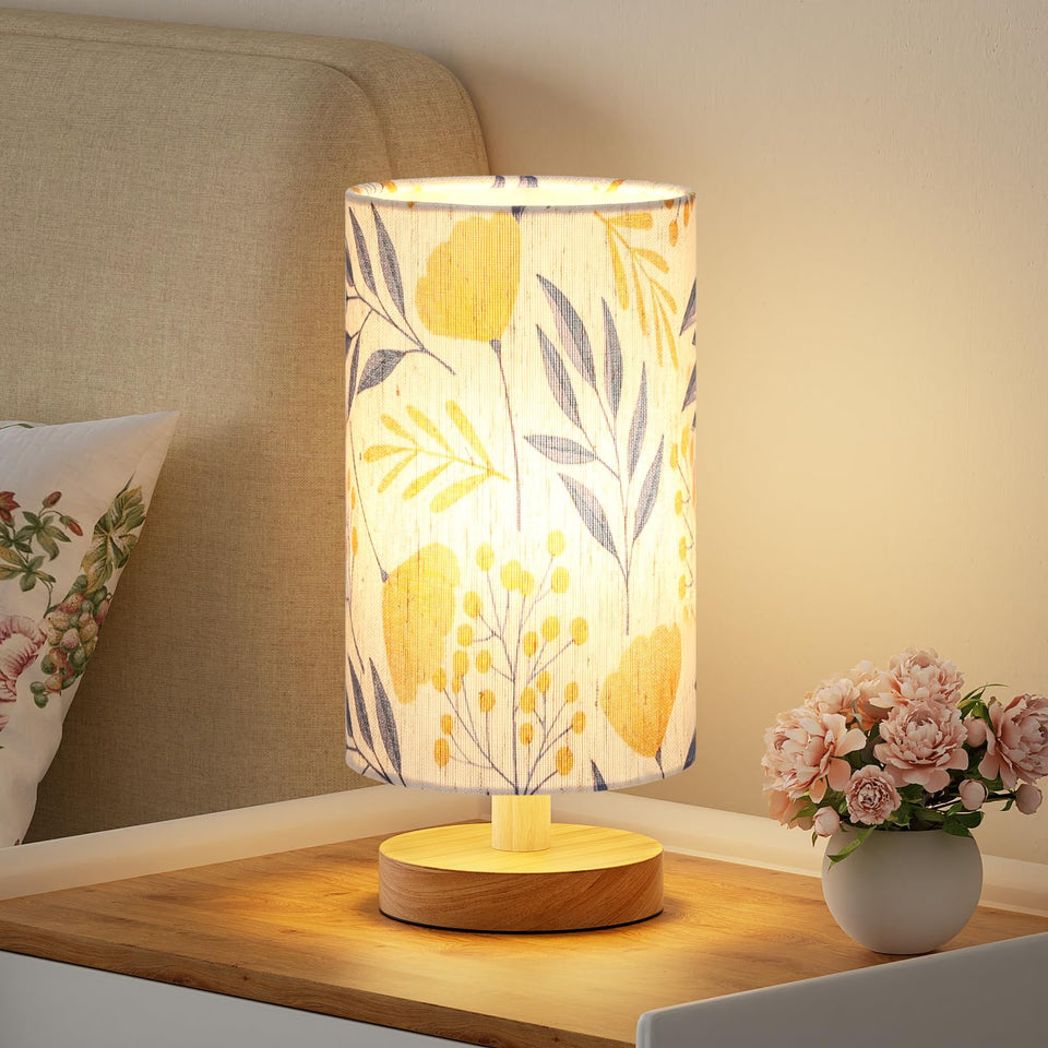 Fenmzee Ginkgo table lamp on a bedroom nightstand emitting a warm glow