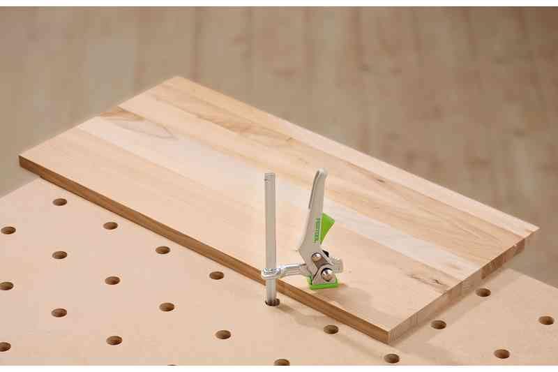 Festool quick clamp securing a workpiece during routing or sanding