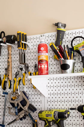 First Alert EZ Fire Spray nozzle in action delivering wide-area coverage.