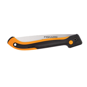 Fiskars Power Tooth Folding Saw in overhand cut use with strong grip.