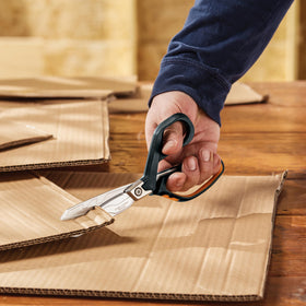 Fiskars PowerArc shears in action on a construction site.