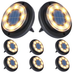 Flacchi solar disk lights illuminate a garden path at dusk for safe navigation