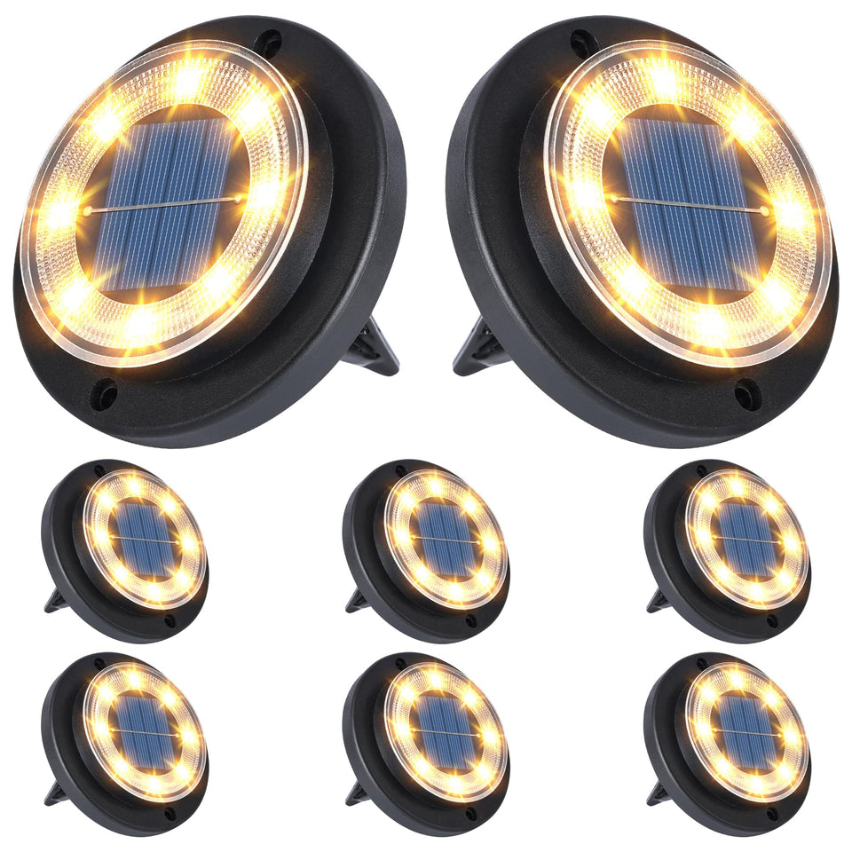 Flacchi solar disk lights illuminate a garden path at dusk for safe navigation