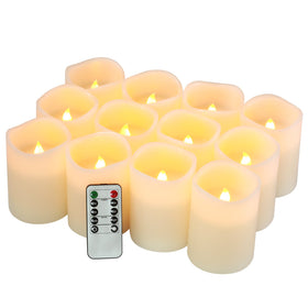 FlameCan flameless candle set of twelve 4-inch pillars providing warm ambiance