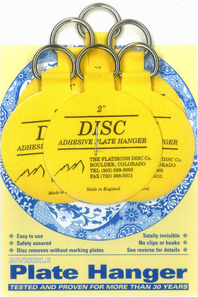 Flatirons Disc adhesive plate hangers 6-pack keep plates flush and secure on walls.