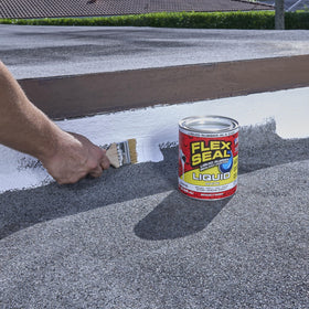 Flex Seal Liquid brush-on seal on a roof seam provides waterproof protection