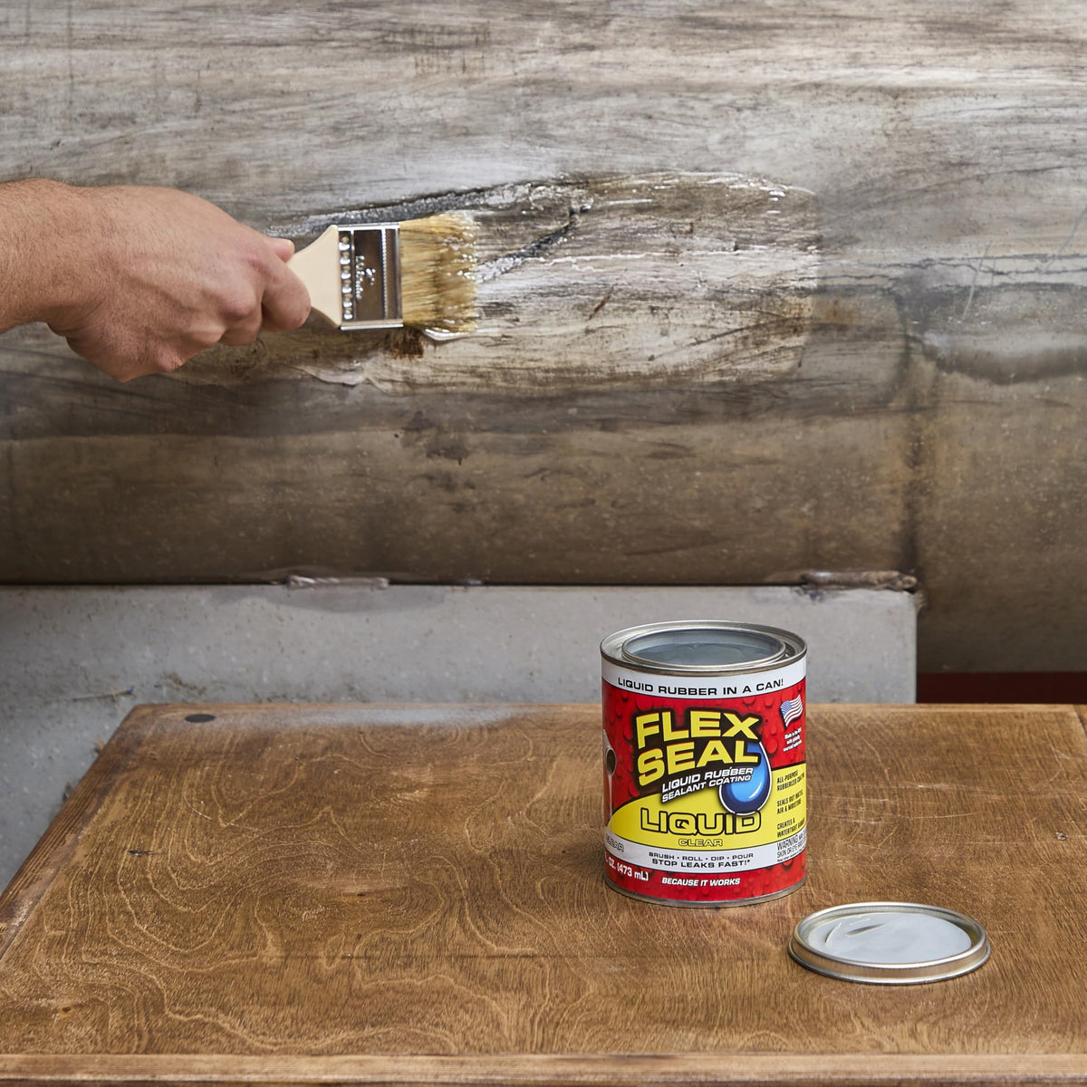 Flex Seal Liquid waterproof coating applied to a roof surface for protection