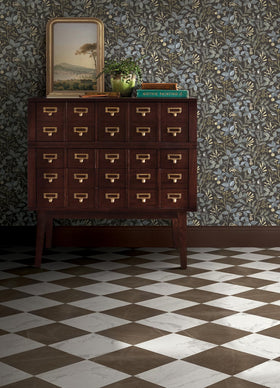 FloorPops Chris Loves Julia Bronze peel-and-stick tiles applied to a smooth surface.