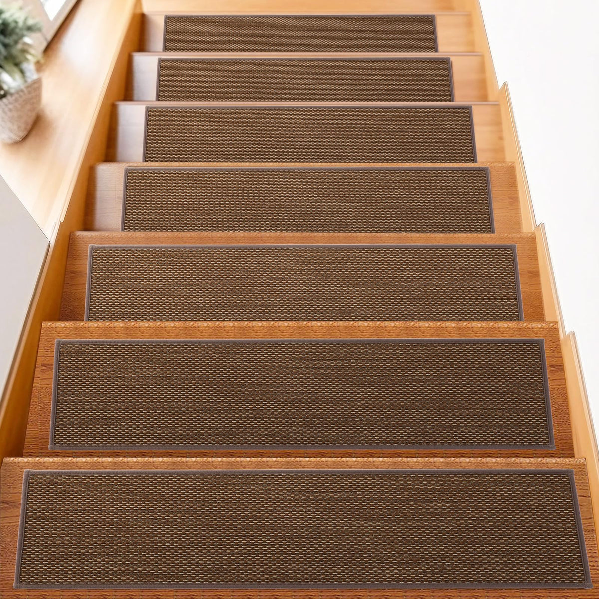 FlowaFoli stair treads with non-slip backing on wood steps for safety.