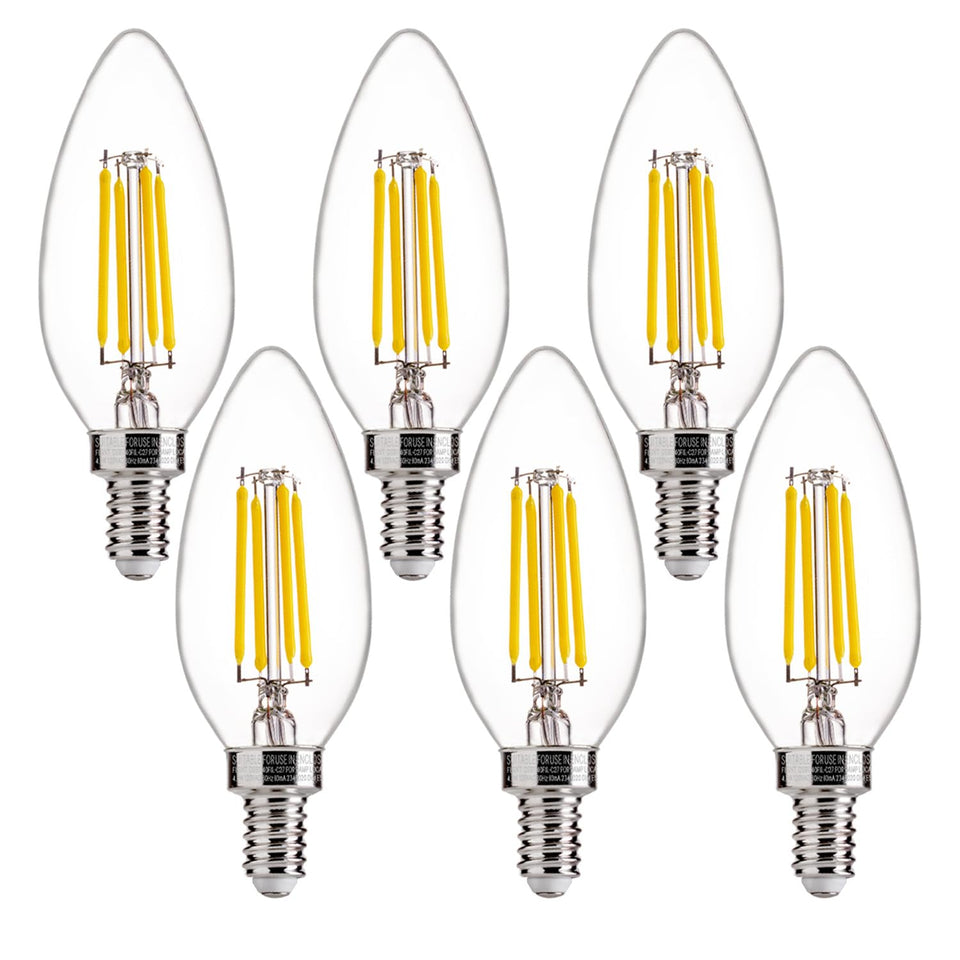 FLSNT 5000K daylight bulbs illuminate a chandelier with clear glass finish for bright ambiance.