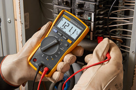 Fluke 115 multimeter measures voltage, resistance, and continuity with reliable accuracy.