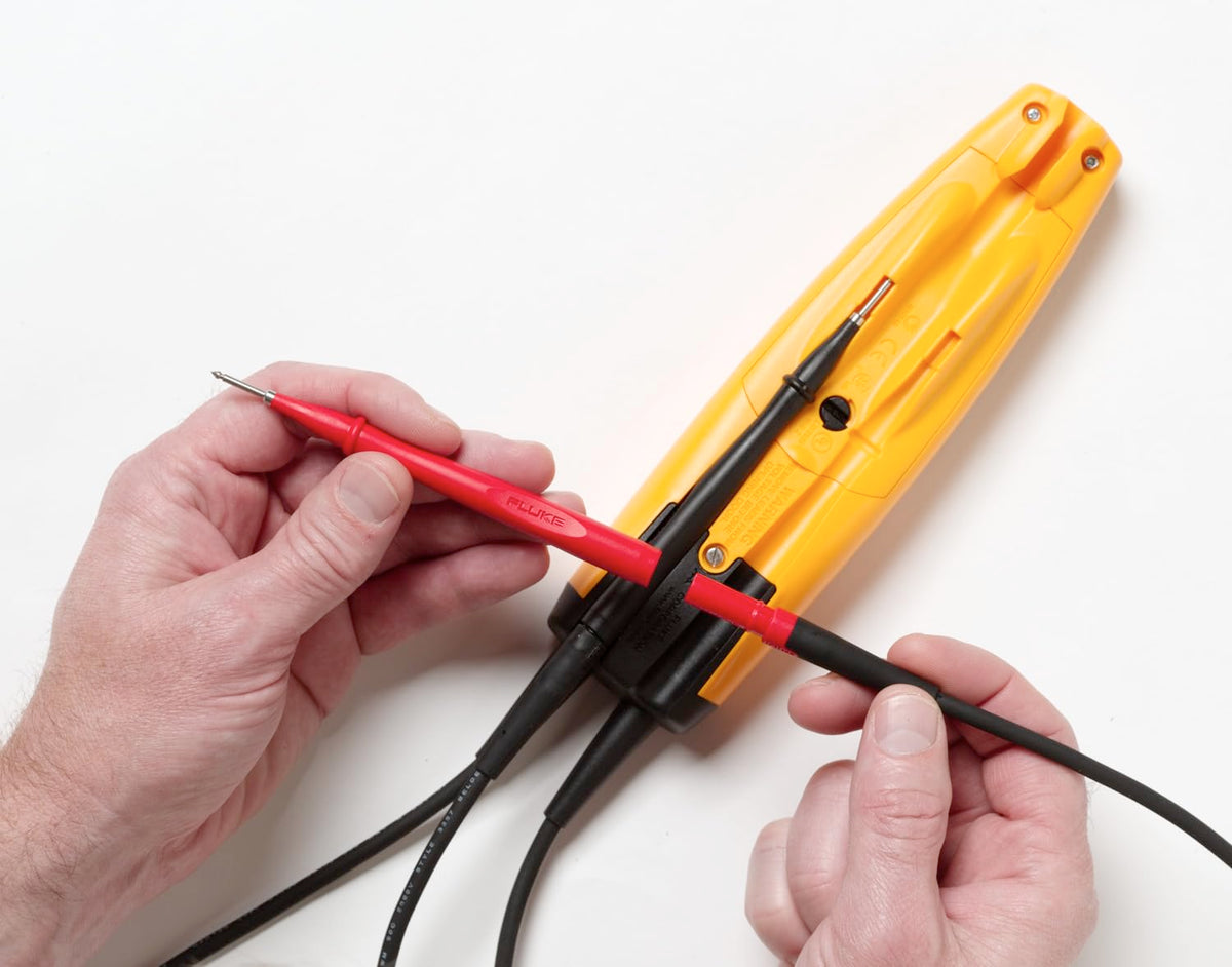 Fluke T+PRO backlit display showing precise voltage readings