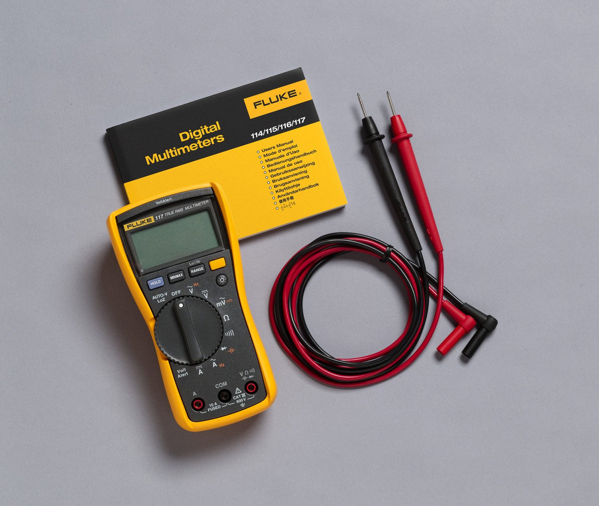 Fluke 117 shows AutoVolt automatic voltage selection for versatile testing.