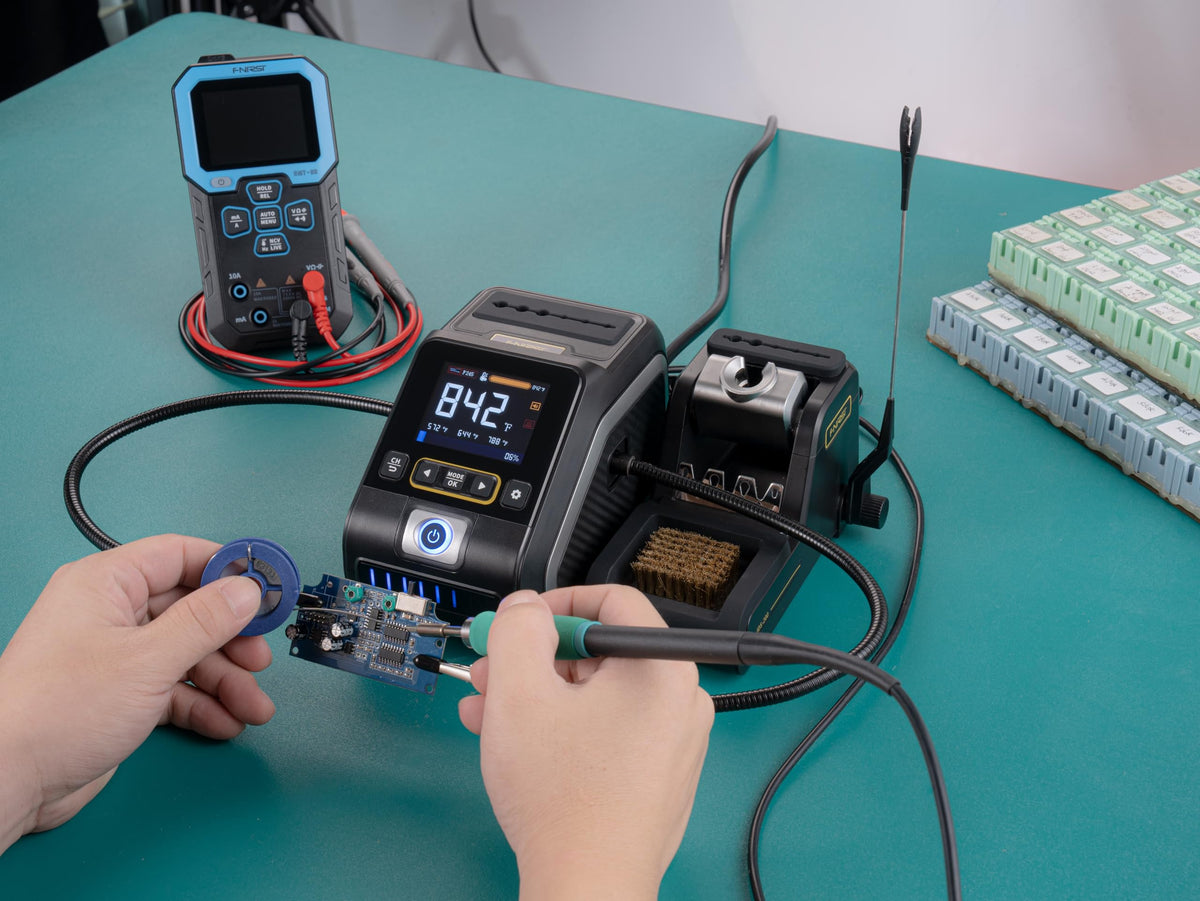 FNIRSI DWS-200 shown with two helping hands for steadier soldering.
