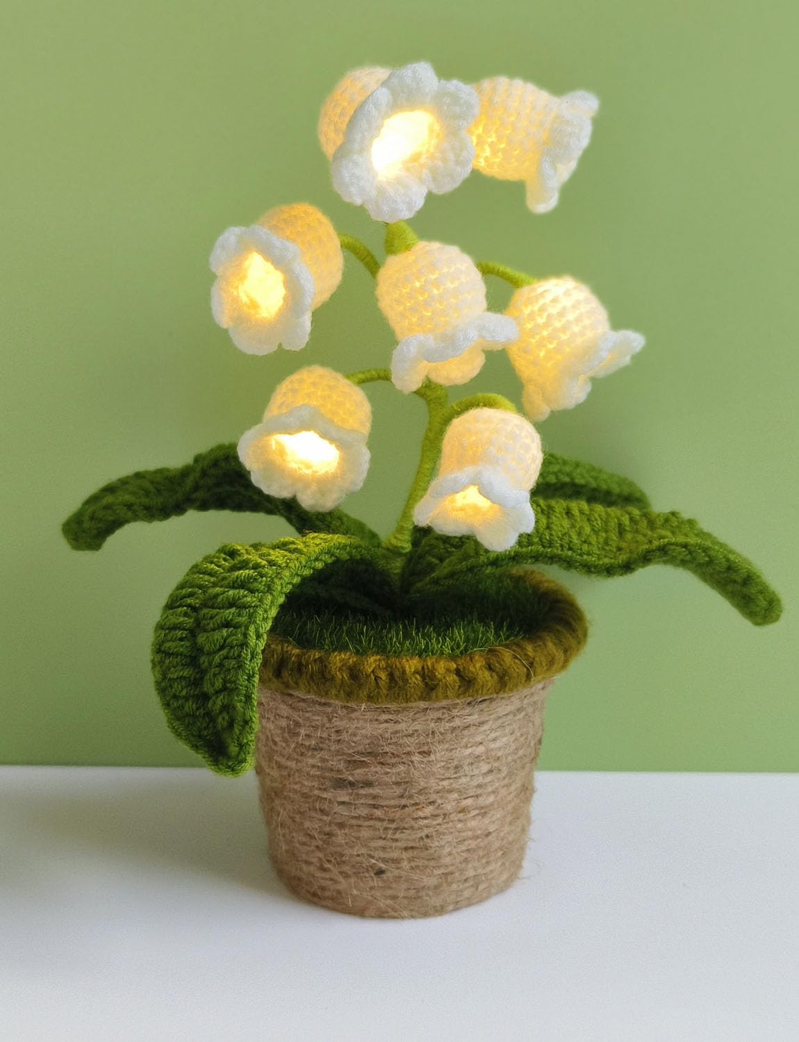 Forvermand Lily of the Valley Lamp with blooming stems emits a soft ambient glow.
