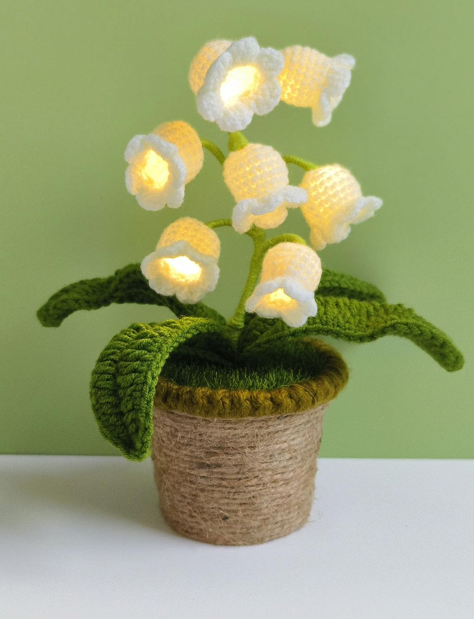 Forvermand Lily of the Valley Lamp with blooming stems emits a soft ambient glow.