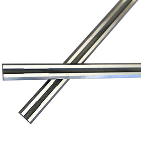 FOXBC carbide close-up on 3-1/4 in planer blades reveals sharp edge for clean starts.