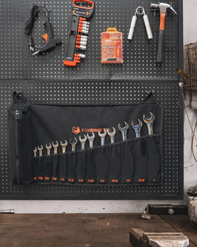 Foxrino wrench roll on workshop wall, tools visible at a glance.