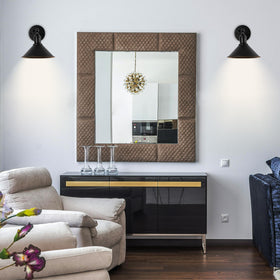 Franing vintage black sconce with dimmed light highlighting versatility for mood lighting