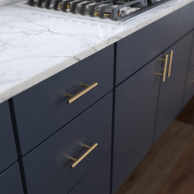 Franklin Brass champagne bronze bar pull on a drawer front for modern update