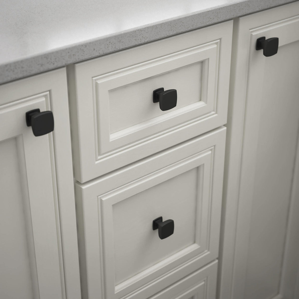 Franklin Brass Parow knob on kitchen cabinet, matte black, adds modern premium feel.