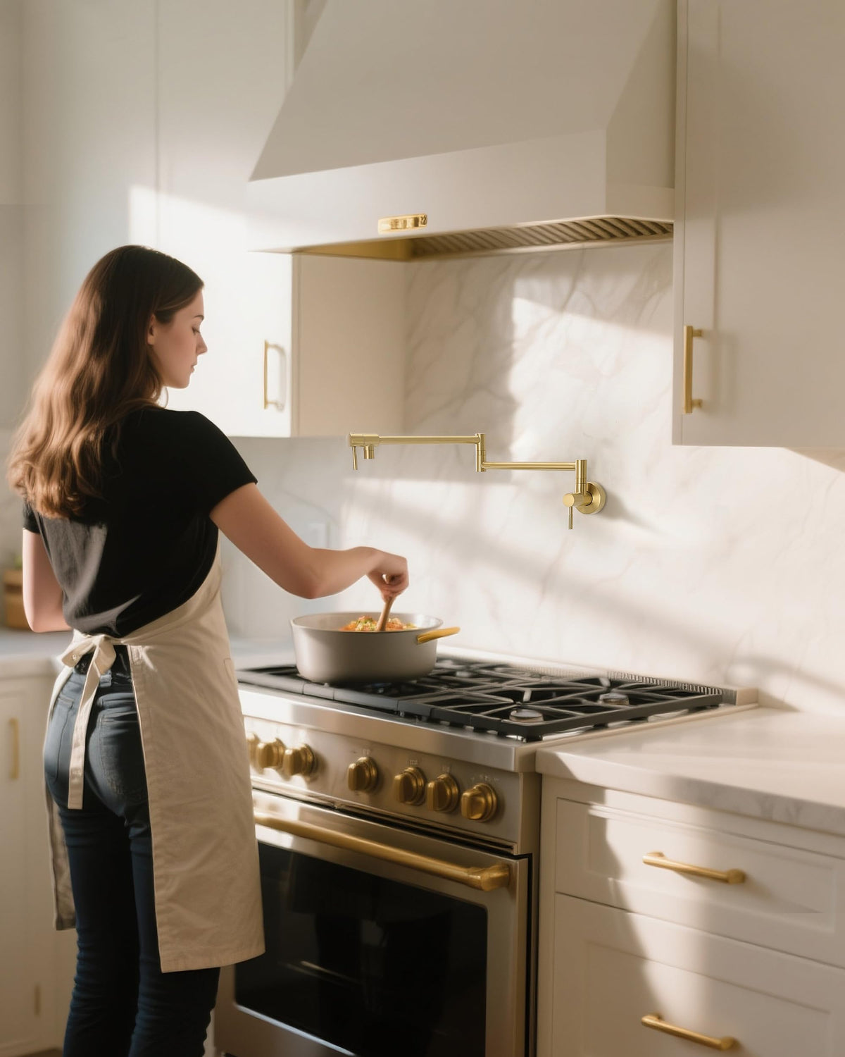 Fransiton folding-arm pot filler with gold finish and versatile reach.
