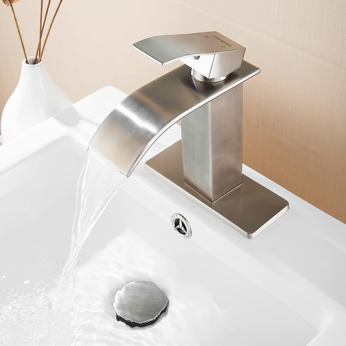 Fransiton brushed nickel waterfall faucet mounted on sink with holes