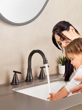 Fransiton oil rubbed bronze faucet side angle highlights widespread 8-inch span.