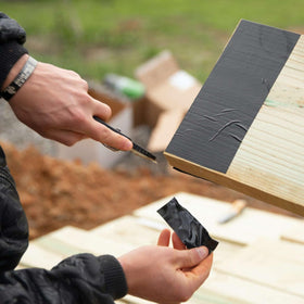 FrogTape Pro Grade backing conforms to joist contours for a tight seal.
