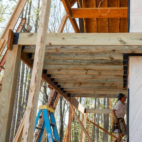 FrogTape Pro Grade adhesive adheres to treated wood and remains secure.