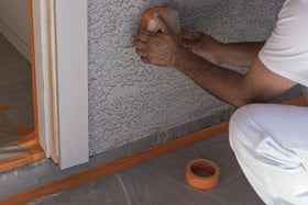 FrogTape ProGrade Orange on vinyl trim provides reliable adhesion for precise masking