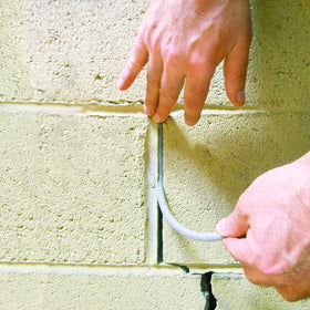 Frost King Caulk Saver bulk-contractor box keeps tools organized for jobs.