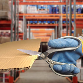 FTECYBO heavy-duty scissors cutting corrugated cardboard easily for quick repairs.