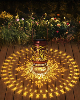 Hanging Fussion solar lanterns casting decorative light on a patio